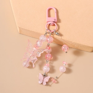 Nahaufnahme des rosa Perlen-Schmetterlingsanhängers mit Acrylperlen und Metallverschluss