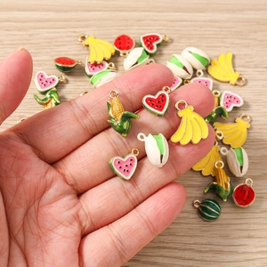 Macro detail of various colorful enamel food charms for DIY jewelry making and crafts