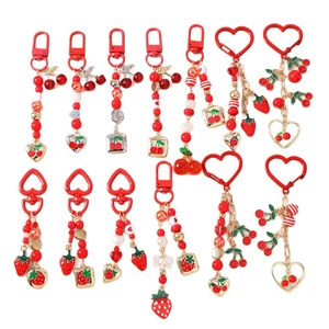 Charming red strawberry and cherry beaded keychain set with metallic gold heart charms