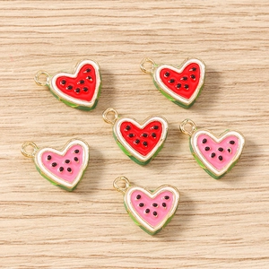 Detail of heart-shaped watermelon pendants with gold plating for DIY jewelry making