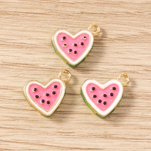 Detail of heart-shaped watermelon enamel charms with gold plating for DIY jewelry