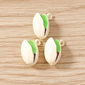 Three pistachio shaped alloy pendants with green kernels for DIY jewelry making