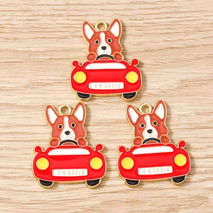 Detailed view of three enamel Corgi dog driving red car charms for jewelry making