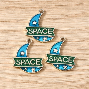 Detailed view of blue enamel crescent moon charms with white stars and SPACE logo