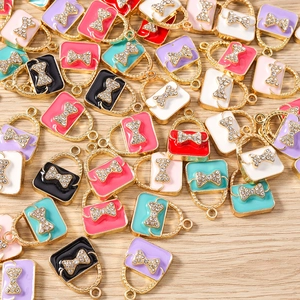 Detail of colorful enamel handbag charms with crystal bows for DIY jewelry making