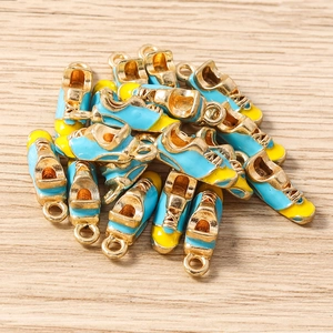 Macro view of blue and yellow alloy sneaker pendants for DIY jewelry making