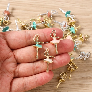 Detailed macro view of colorful enamel ballet girl charms for DIY jewelry making