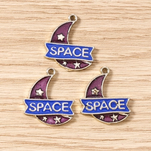 Detailed view of purple enamel crescent moon pendant with blue Space ribbon and star