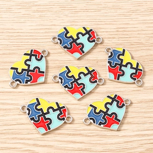 Set of 6 colorful enamel heart puzzle charms for DIY jewelry making on wood background