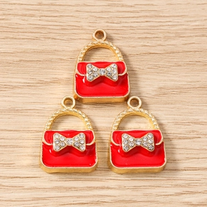 Detail of red enamel handbag charms with crystal bow for DIY jewelry making
