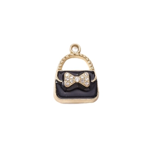 Miniature black enamel handbag pendant with crystal bow and gold-plated finish for DIY crafts