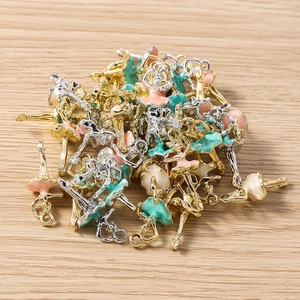 Detail view of ballet girl metal charms with colorful enamel finish for DIY jewelry making