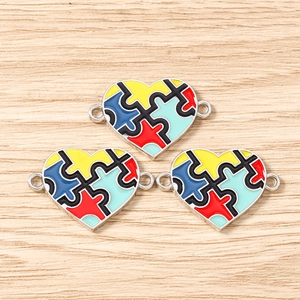 Three pieces of puzzle heart pendants with colorful enamel for DIY autism awareness jewelry