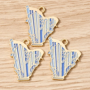 Detailed view of harp pendants with blue enamel filling and golden hollowed edges