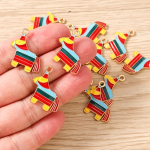Macro shot of colorful striped enamel rocking horse charms for DIY jewelry making