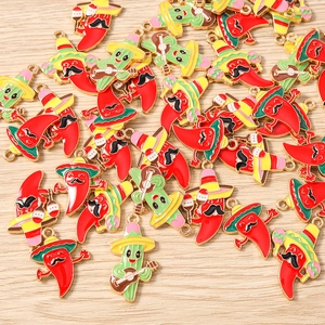 Detail of Mexican style chili and cactus enamel charms for jewelry making crafts