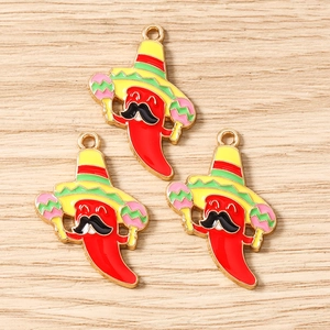Detail of three cartoon red chili charms with Mexican hats and maracas for jewelry making