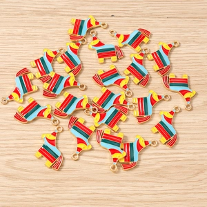 Flat lay of colorful enamel alpaca pendants with gold plating for DIY jewelry making