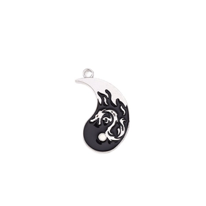 Silver Chinese Tai Chi yin yang pendant with intricate black enamel dragon pattern and ring