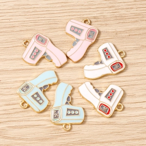 Colorful alloy thermometer charms in pink, blue, and white with gold metal plating