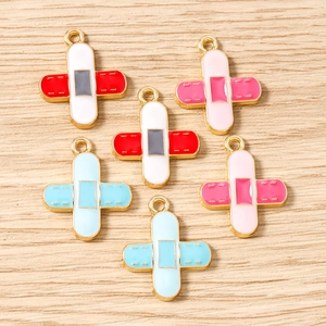 Cross-shaped adhesive bandage charms for DIY jewelry making in blue pink and red