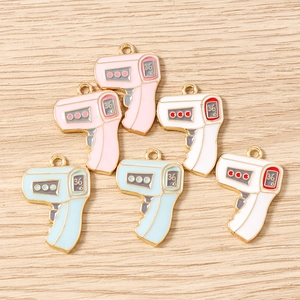 DIY colorful thermometer gun charms in white, pink and blue for jewelry making