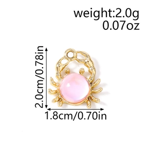 Detailed view of crab charm showing dimensions 2.0cm by 1.8cm and pink gemstone detail