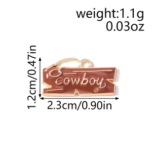 Detailed close-up of brown enamel cowboy charm with golden rope patterns and dimensions