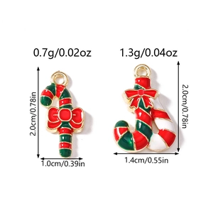 Detail view of Christmas cane enamel charms with red bows for DIY jewelry making