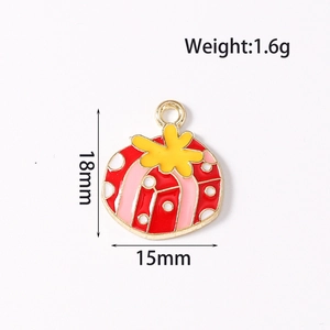 Detailed view of enamel Christmas gift box pendant with dimensions 18mm by 15mm