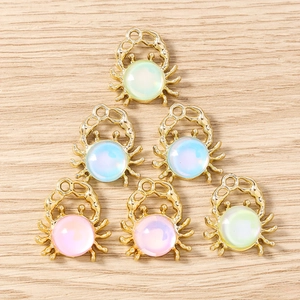 Set of six gold alloy crab pendants with colorful faux pearls for DIY jewelry making