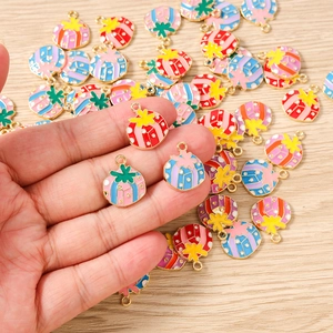 Detailed macro view of colorful alloy enamel gift box charms with star accents for DIY jewelry
