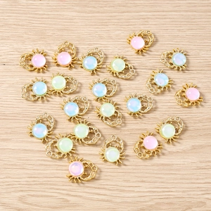 Detailed macro view of colorful crab pendants for DIY jewelry with gold alloy base