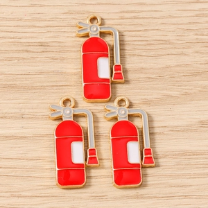 Detail of red fire extinguisher enamel charms for DIY jewelry making and keychains