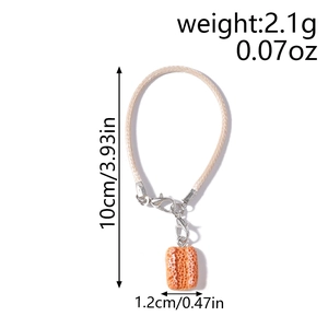 Detailed view of resin bread pendant phone strap with dimensions and lobster clasp