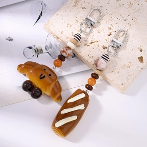 Chic croissant and baguette food keychain with colorful beads and silver swivel clasp