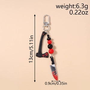 Detail view of Halloween beaded keychain with bloody axe and knife charms and dimensions