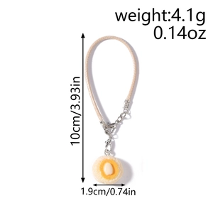 Detailed dimensions of fried egg pendant showing 10cm length and 1.9cm width on a white background