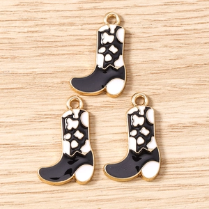 Detail of cow print cowboy boot charms with gold plating for DIY jewelry making
