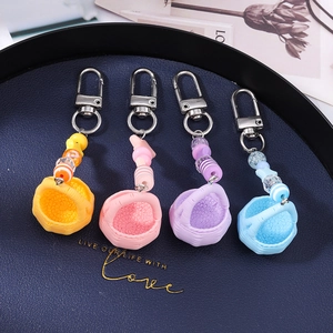 Colorful woven basket keychains with beaded stars and silver hooks for bags