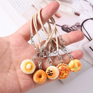Detailed set of realistic donut and bread bag charms with durable braided straps