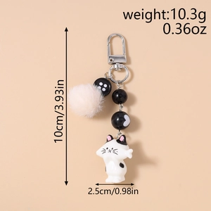 Detailed view of cat charm with beige pompom and striped beads including size measurements