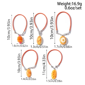 Detailed view of artificial hot dog and bread charms with orange woven phone straps