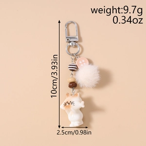 Detail view of cute cat keychain showing size 10cm by 2.5cm with beads and pom pom