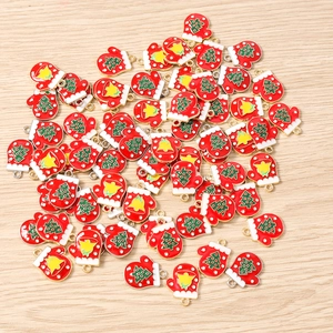 Detail of DIY Christmas glove charms with enamel finish and holiday tree patterns
