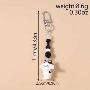 Detail showing 11cm cat keychain dimensions and weight specifications with lobster clasp