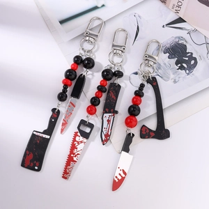 Halloween bloody weapon keychain featuring red and black beads with realistic tool charms