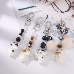 Cute cat keychain set with striped beads, soft plush pompoms and silver carabiner clip