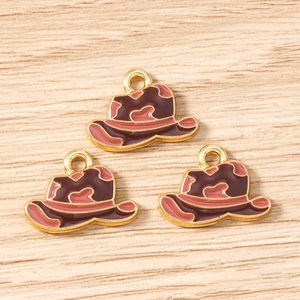 Macro view of cowboy hat alloy pendants with enamel coating for DIY jewelry making