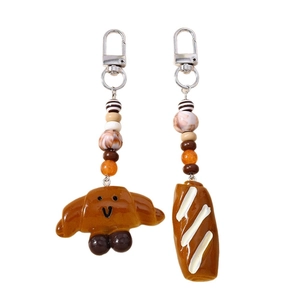 Cute croissant and baguette food keychain set with decorative beads and metal clasp